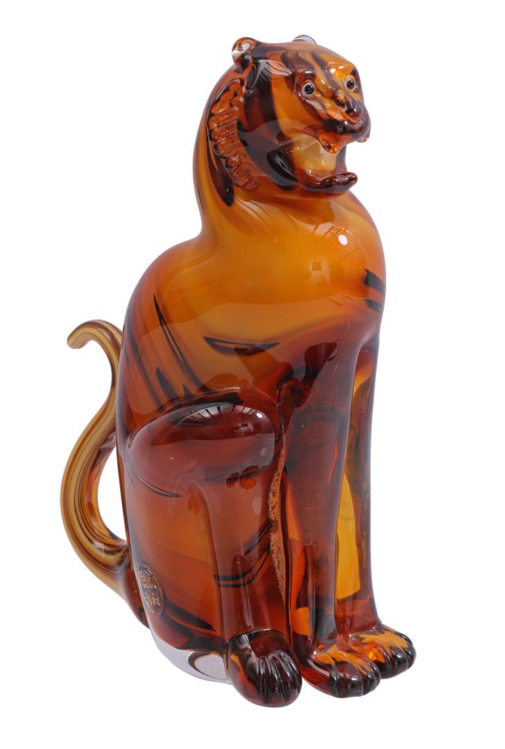 Glass sculpture of a sitting tiger